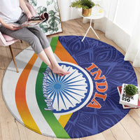 Round mandala carpet with blue paisley, white Ashoka wheel, orange 'AZADI' and green/orange stripes