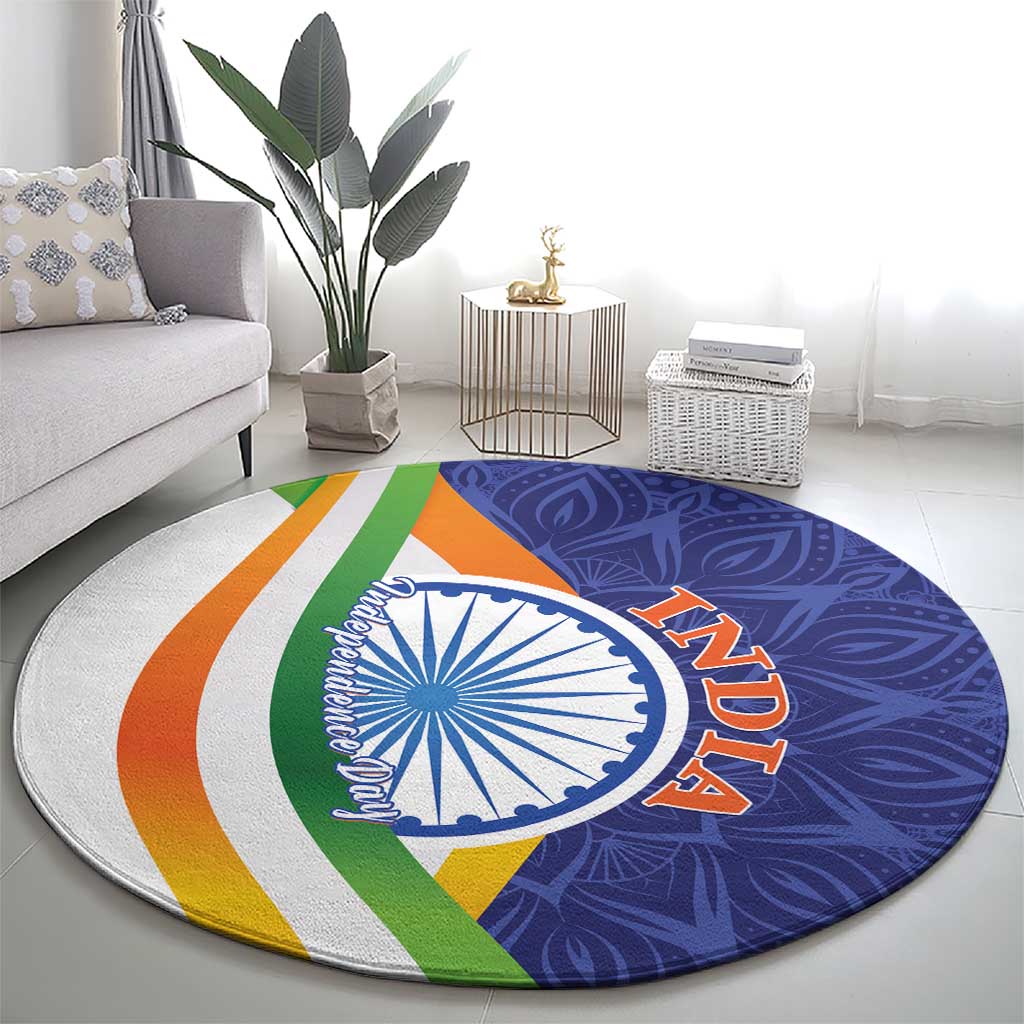 Round mandala carpet, blue paisley design with white Ashoka wheel and 'AZADI' in orange