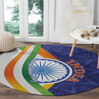Round mandala carpet with blue paisley background, white Ashoka wheel, multicolor stripes and 'AZADI'