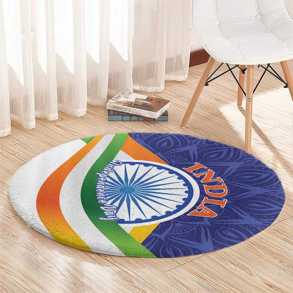 Round mandala carpet, blue and white Ashoka wheel with orange 'AZADI' and green/orange bands