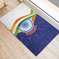 Rubber doormat angled view, blue paisley field with tricolor arcs and 'INDIA' emblem