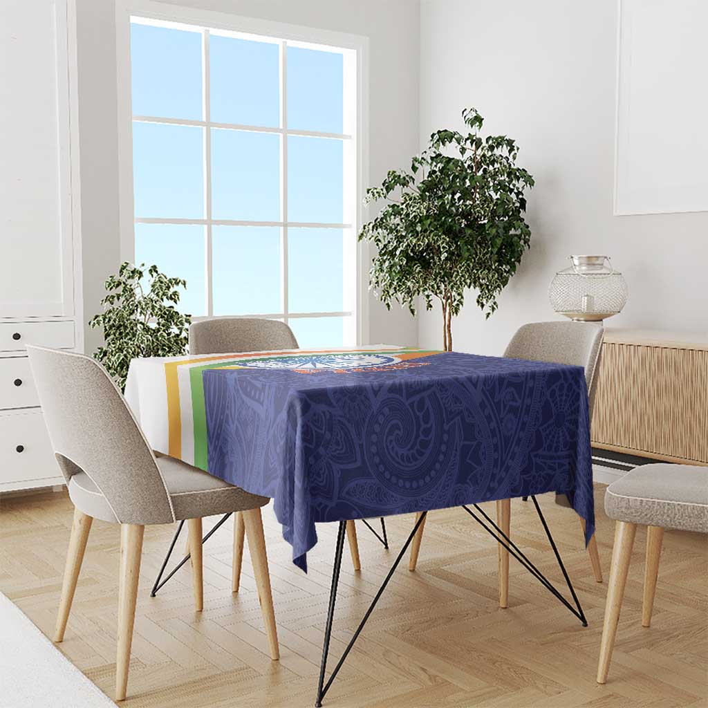 Blue paisley mandala tablecloth covering a dining table with tricolor border