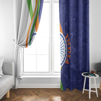 Window curtain panels tied at the center: white tricolor diagonal stripe and blue paisley