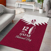 Red rectangular area rug with white map outline, 12 mark, and Qatar National Day text