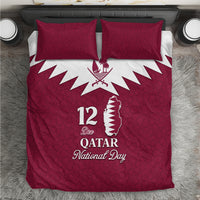 Red Qatar National Day bedding set with two square pillows and white crest on duvet