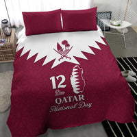 Red bedding set with two square pillows and central white emblem with “12 Dec” text
