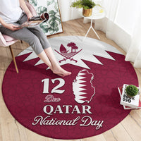 Red round carpet with Qatar map and palm crest, "12 Dec" and "Qatar National Day" text