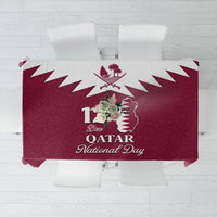 Red tablecloth with Qatar map, Islamic pattern, and “Qatar National Day” lettering.