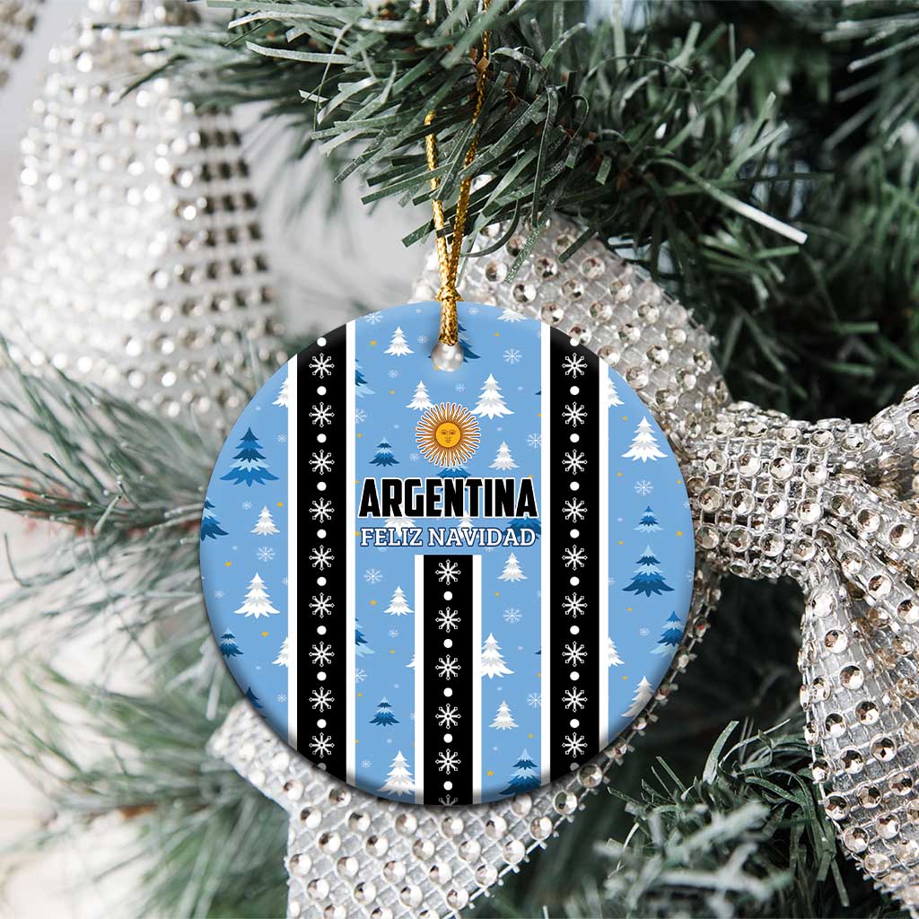Blue circle Argentina Feliz Navidad ornament on a tree, striped with gold sun and snowflake dots.