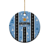 Blue circle Argentina Feliz Navidad ornament with gold hanging loop and striped snow tree pattern.