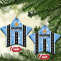 Blue star-shaped Argentina Feliz Navidad ornaments hanging, striped with gold sun and snowflake dots.