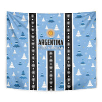 Blue Christmas tapestry close-up: pine trees, sun emblem, and 'Argentina Feliz Navidad' text