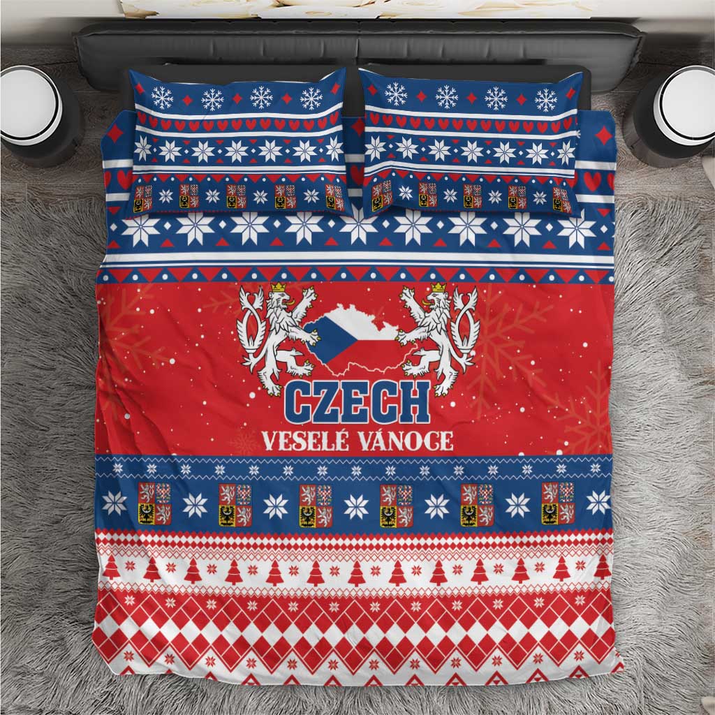 Christmas bedding set with red, blue, and white Czech holiday pattern on a duvet cover.