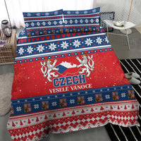 Red and blue Czech Christmas bedding set with crest and festive Nordic border on duvet cover.