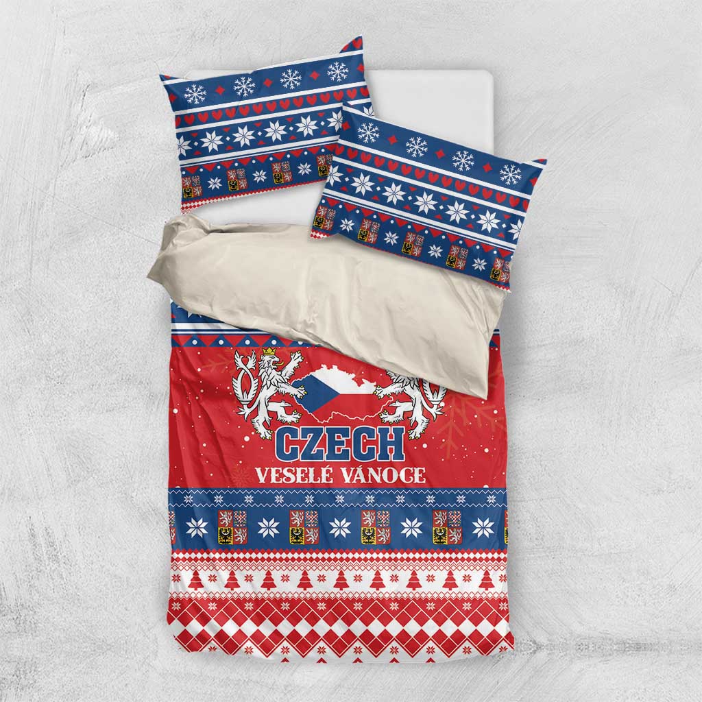 Flat-lay Czech Christmas bedding set with red duvet cover and two blue patterned pillowcases.