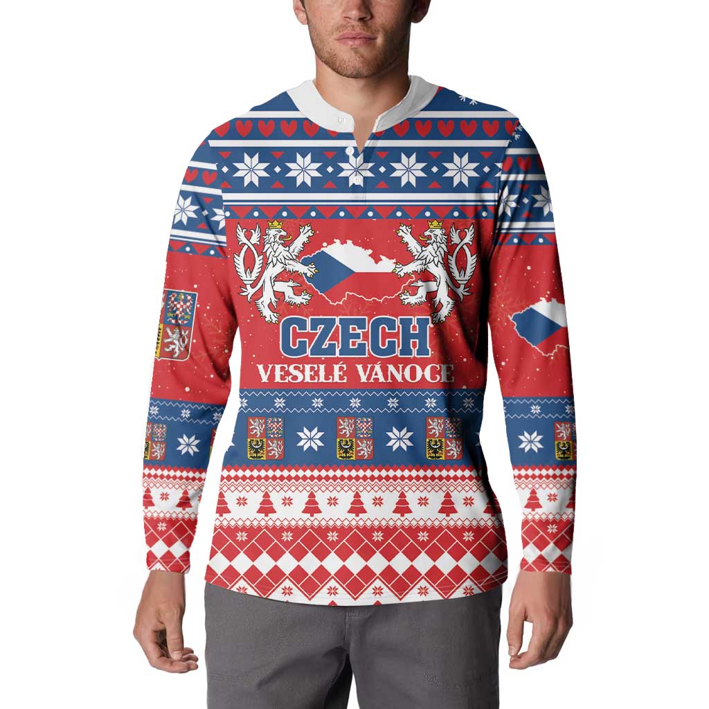 Red and blue patterned button-up Christmas sweatshirt worn by a male model