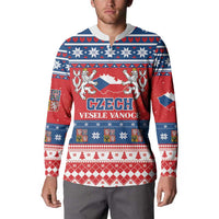 Red and blue patterned button-up Christmas sweatshirt worn by a male model