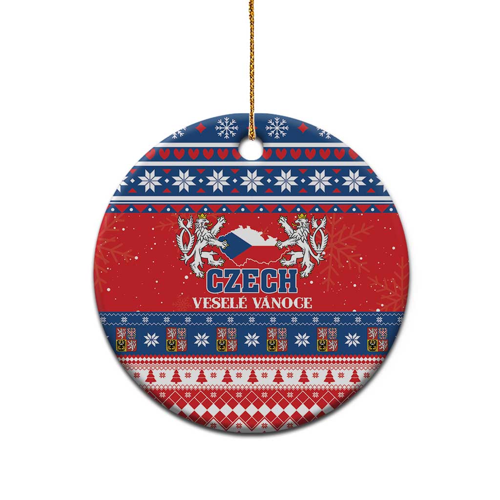 Red ceramic circular Christmas ornament with Czech coat design, blue folk bands, gold hanging loop