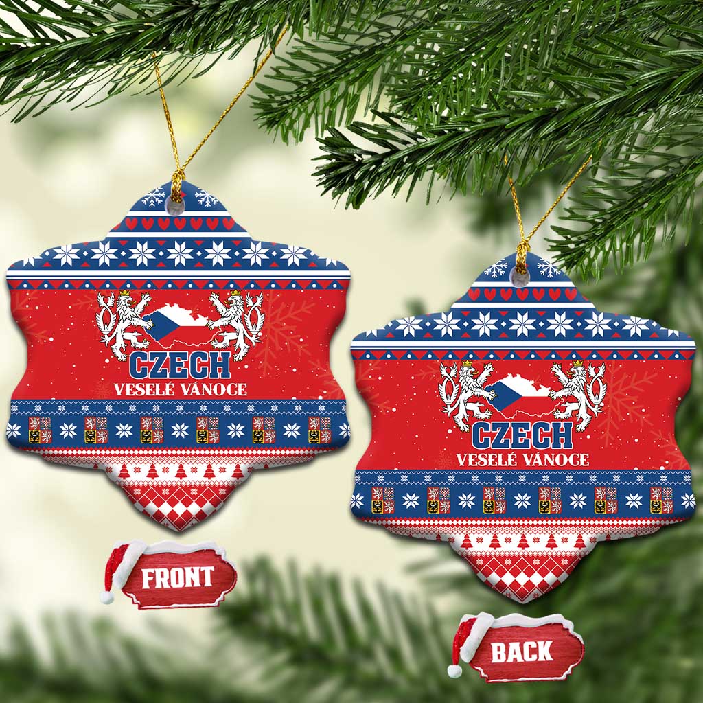 Red ceramic heart-shaped Christmas ornament with Czech coat design, blue folk bands, gold loop