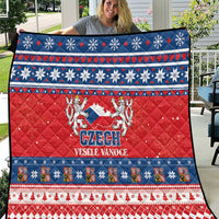 Red Czech Christmas quilt with blue border, snowflakes, stripes, and Czech emblem text