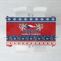 Red Christmas tablecloth with blue and white snowflake border and Czech crest graphic