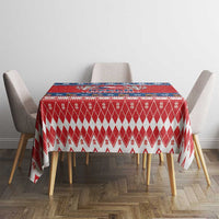 Red Christmas tablecloth with red-and-white diamond and snowflake pattern, rectangular
