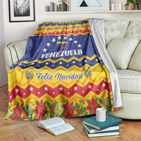 Venezuela Christmas blanket with blue base, yellow zigzags, and Feliz Navidad text
