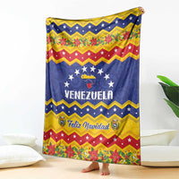 Venezuela Christmas blanket hanging with blue, red, and yellow chevron pattern