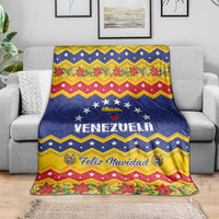 Venezuela Christmas blanket draped over sofa with stars and floral holiday border