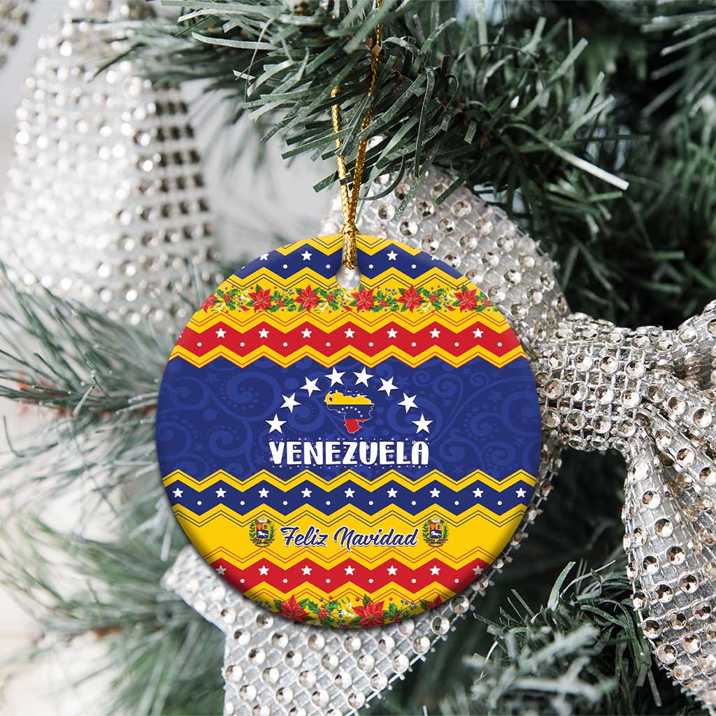 Round ceramic Venezuela Feliz Navidad ornament on a Christmas tree with gold hanging string