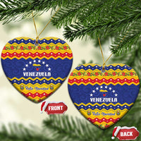 Heart-shaped ceramic Venezuela Christmas ornament with gold hanging string and Feliz Navidad design