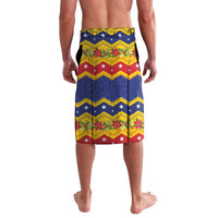 Festive lavalava shorts with zigzag print in red, yellow, and green on blue