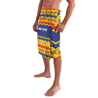 Festive lavalava shorts side view with blue-and-yellow chevrons and custom text panel