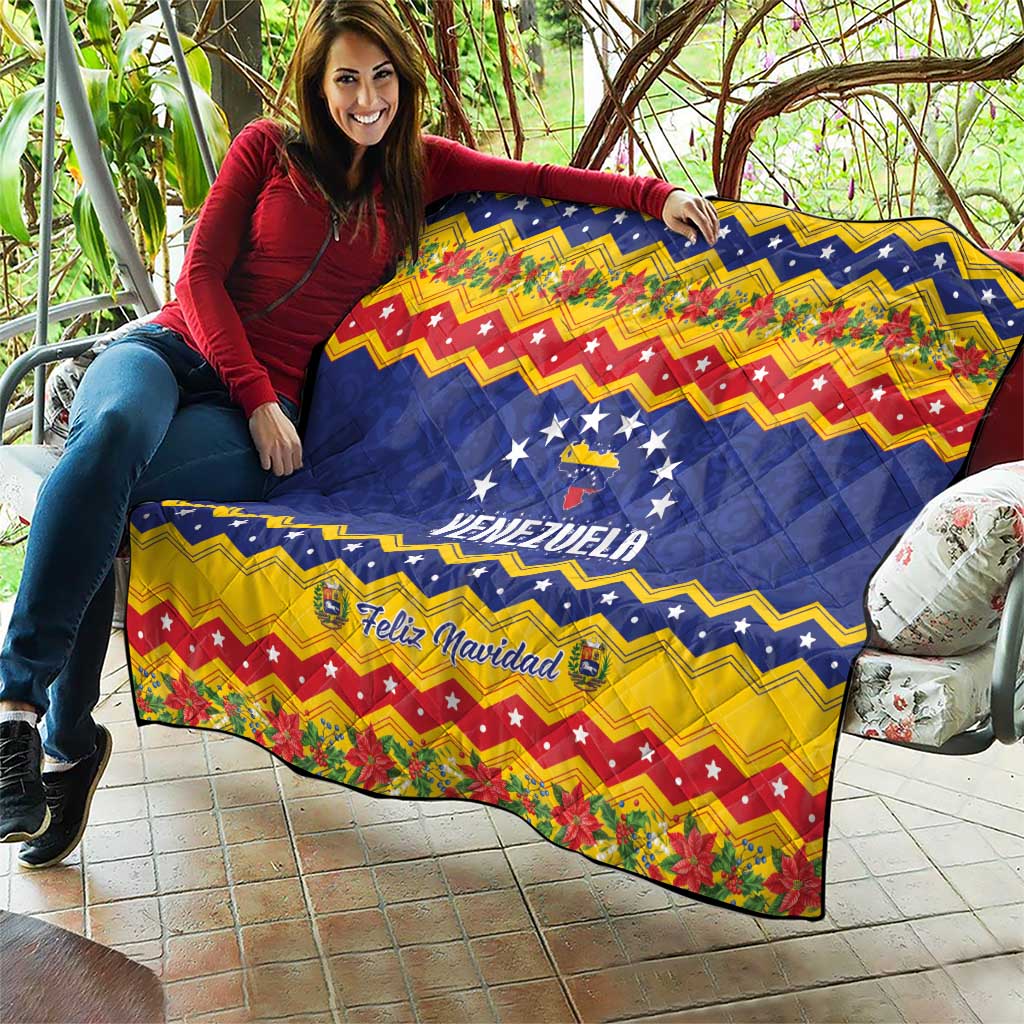 Venezuela Christmas quilt draped over furniture, blue stars and VENEZUELA with Feliz Navidad