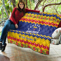 Venezuela Christmas quilt draped over furniture, blue stars and VENEZUELA with Feliz Navidad