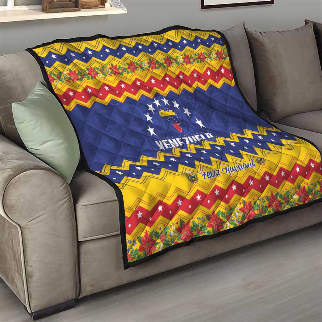 Venezuela Christmas quilt on sofa, blue star logo and Feliz Navidad across zigzag bands