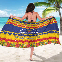 Christmas sarong worn as a beach wrap, navy blue with yellow and red zigzag stripes