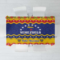 Christmas tablecloth with blue, red, and yellow zigzag stars and “Feliz Navidad” text
