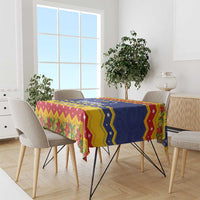 Christmas tablecloth draped on dining table with bold Venezuela flag-style zigzag design