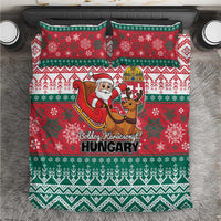 Red and green Christmas bedding set with Santa and reindeer graphic on duvet