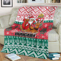 Hungarian Christmas blanket draped on couch arm, red top and green snowflake pattern