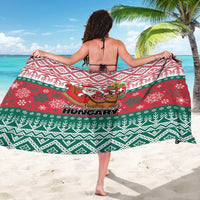 Red, green, and white patterned Hungary Christmas sarong draped around shoulders