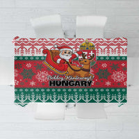 Red and green Hungary-themed Christmas tablecloth with Santa, reindeer, and festive border.