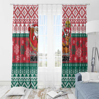 Red and green Christmas window curtains with Santa and reindeer and 'Hungary' text