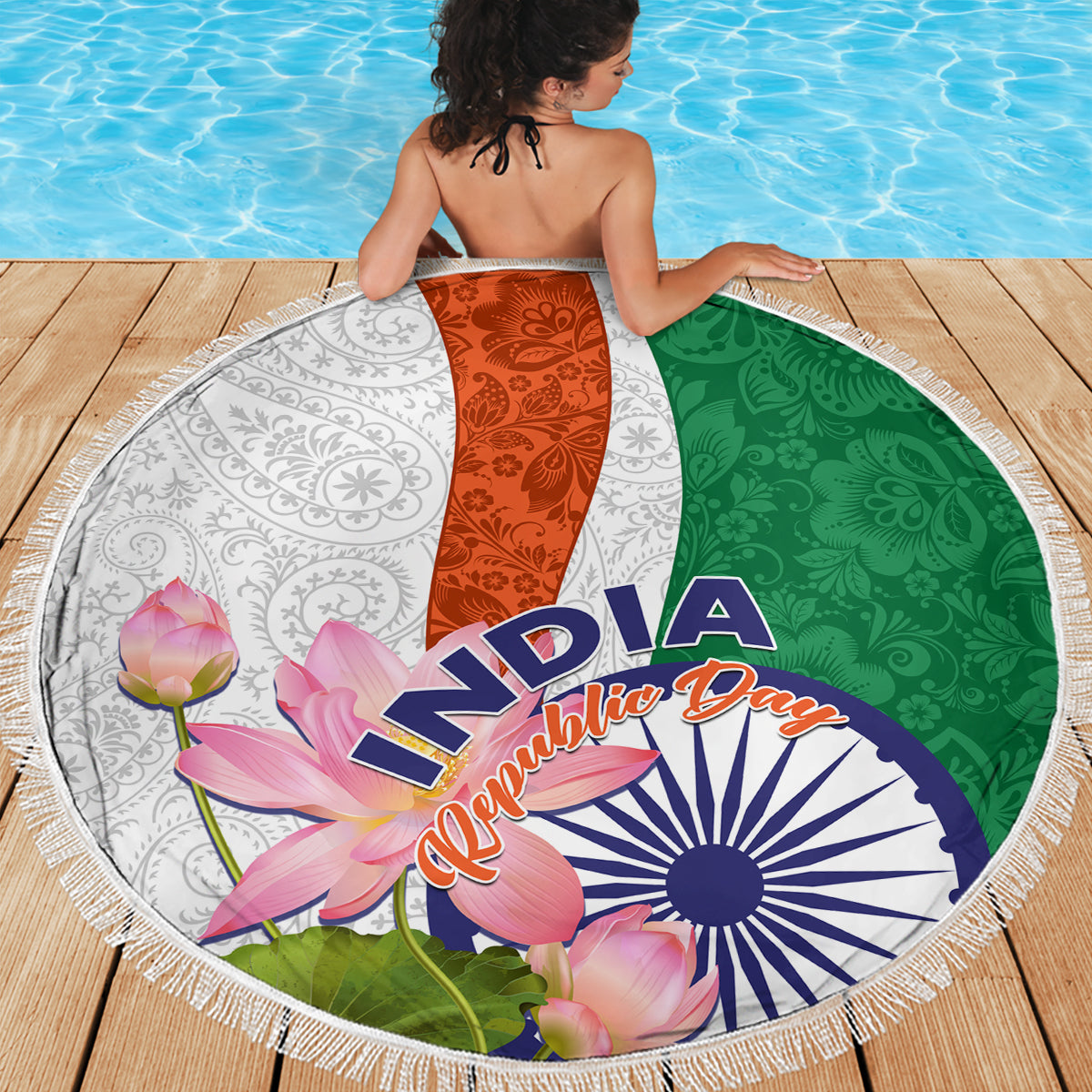 Round beach blanket with fringed edge, orange center panel, green and white paisley lotus India