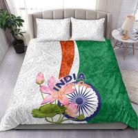 Bedding set on bed: white paisley pillowcases, green and orange floral duvet with India graphic
