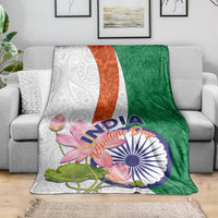 Floral paisley throw blanket with lotus and India print; green and white with orange stripe