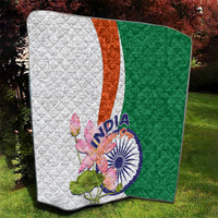 Quilt with quilted texture in green and white, orange middle stripe, floral paisley lotus print