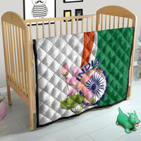 Quilt for crib with green and white panels, orange stripe, and India lotus floral paisley print
