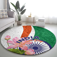 Round carpet with India text, lotus floral accents, and green orange white paisley design
